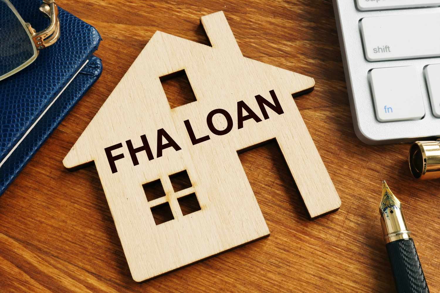 fha-loan-written-on-the-model-of-home--1128492843-5bbea0d8b1ad435f9a3a1692e0180bdd