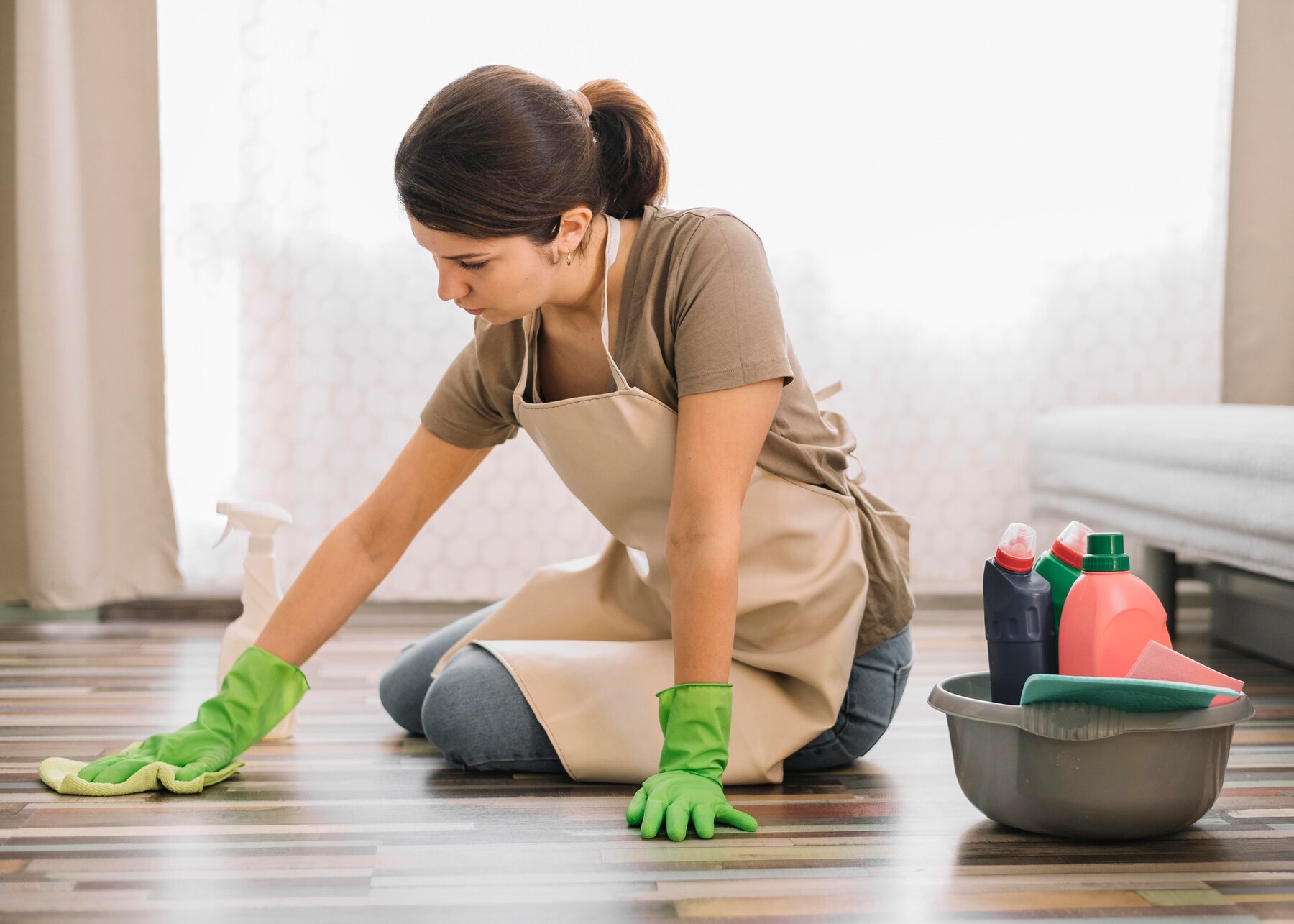 65d5b19950d874f282b5c35f_woman-with-gloves-cleaning-floor_23-2148520978