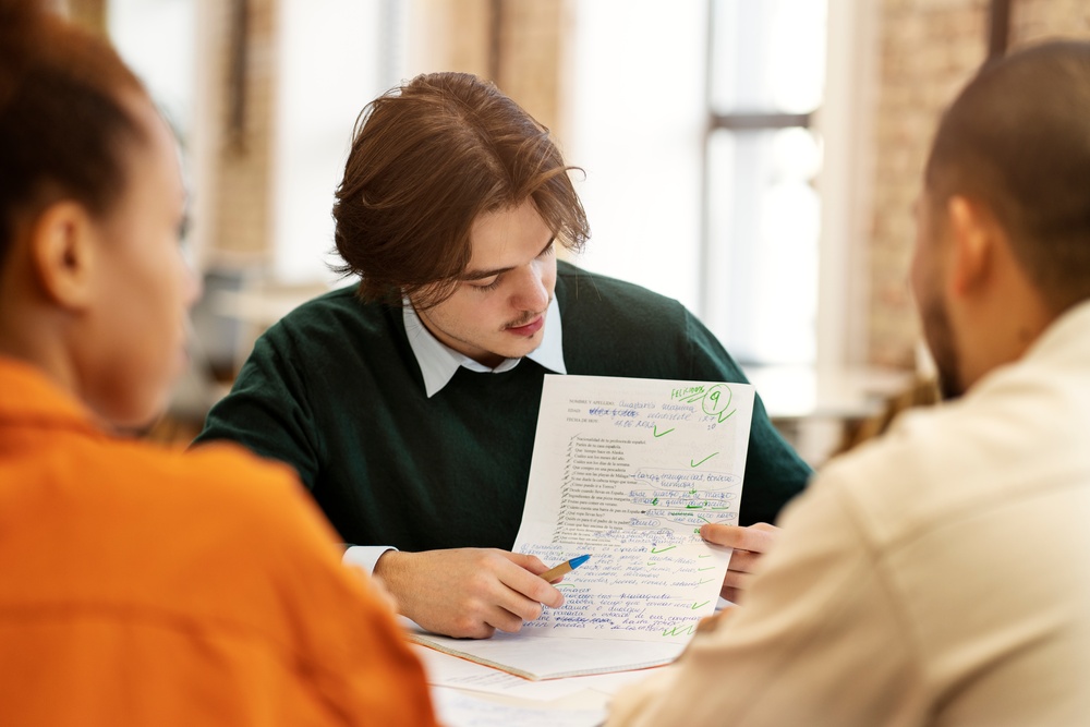 man-studying-grammar-with-his-colleagues (1)