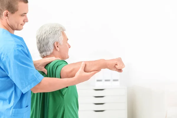 depositphotos_179866726-stock-photo-physiotherapist-working-with-patient-in