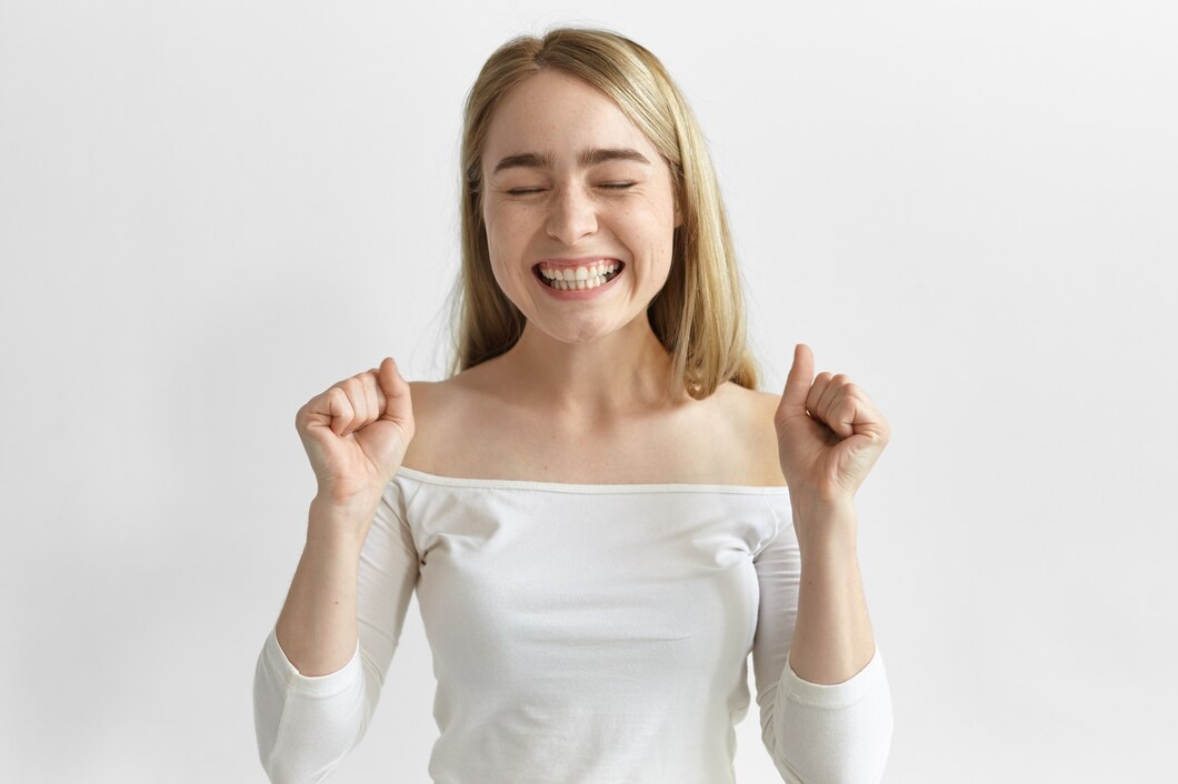 overjoyed-young-blonde-woman-closing-eyes-clenching-fists-exclaiming-yes-feeling-ecstatic-because-her-success-triumph-victory_343059-2986